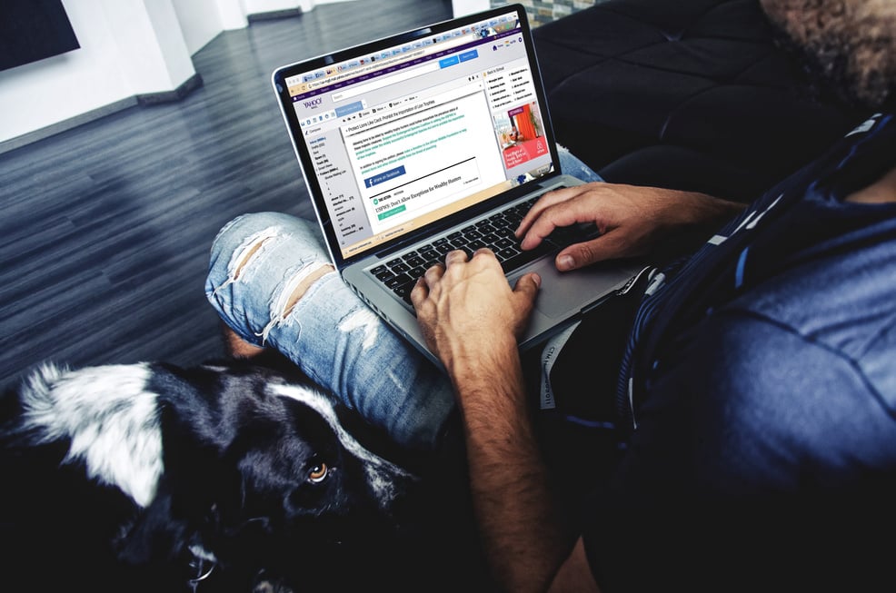 Man Typing on a Laptop